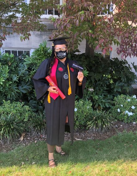 Picture of Woman in Cap and Gown Celebrating